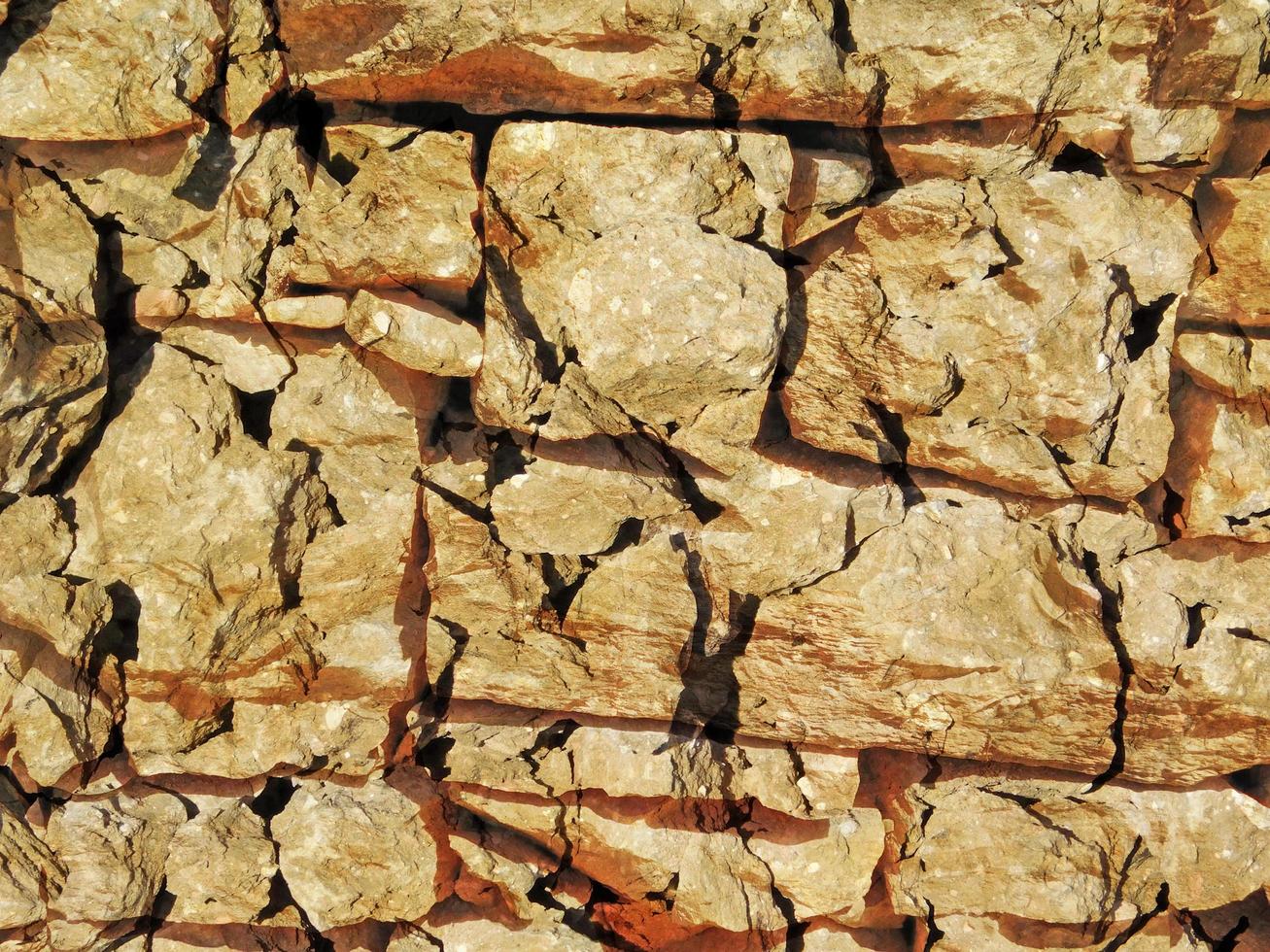 Detail of outdoor stone wall for background or texture photo