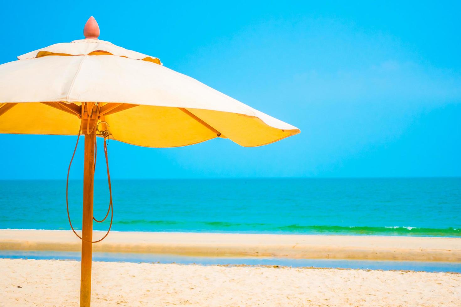 Umbrella on the tropical beach photo