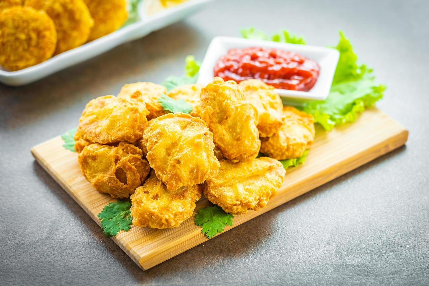 Deep fried chicken nuggets with ketchup photo