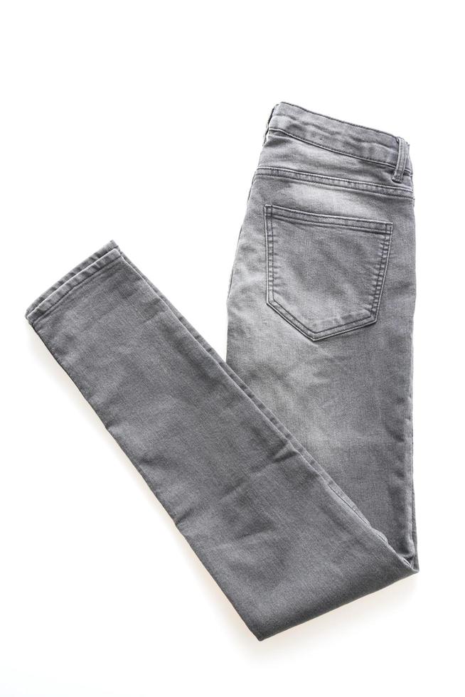 Gray jeans on white background photo