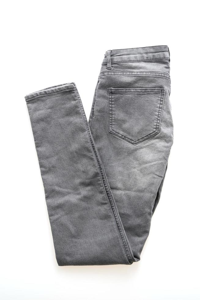 Gray jeans on white background photo