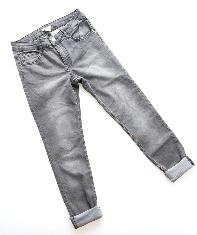 Gray jeans on white background photo