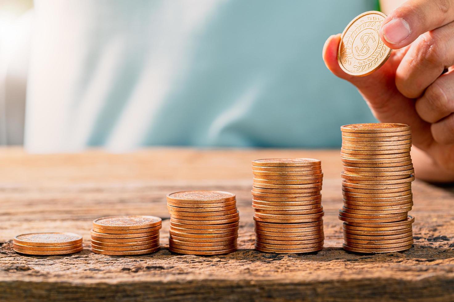 Money coin stack growing graph with sun light photo