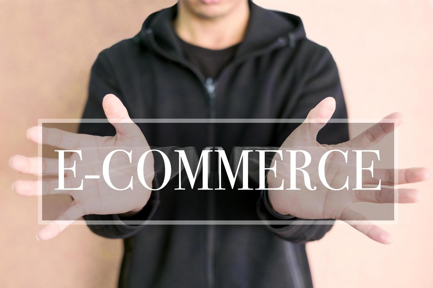 E-commerce concept on a digital screen with human hands photo