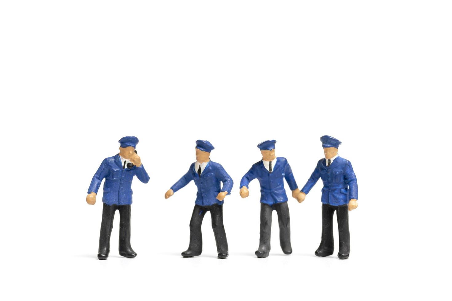 Miniature train staff isolated on a white background photo