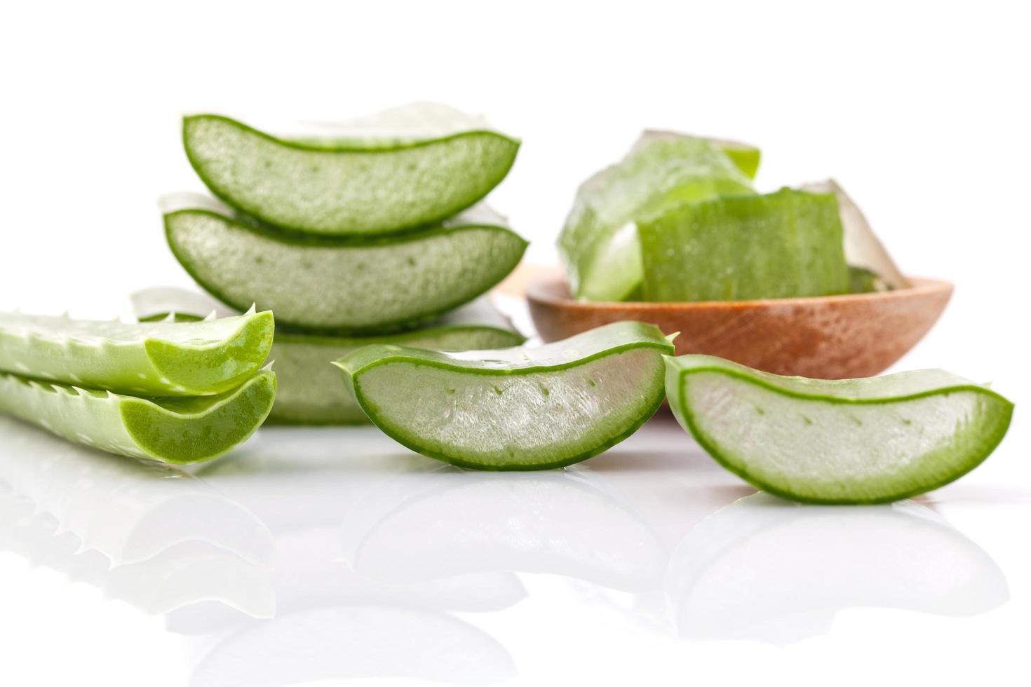 Aloe Vera slices on white with reflection photo