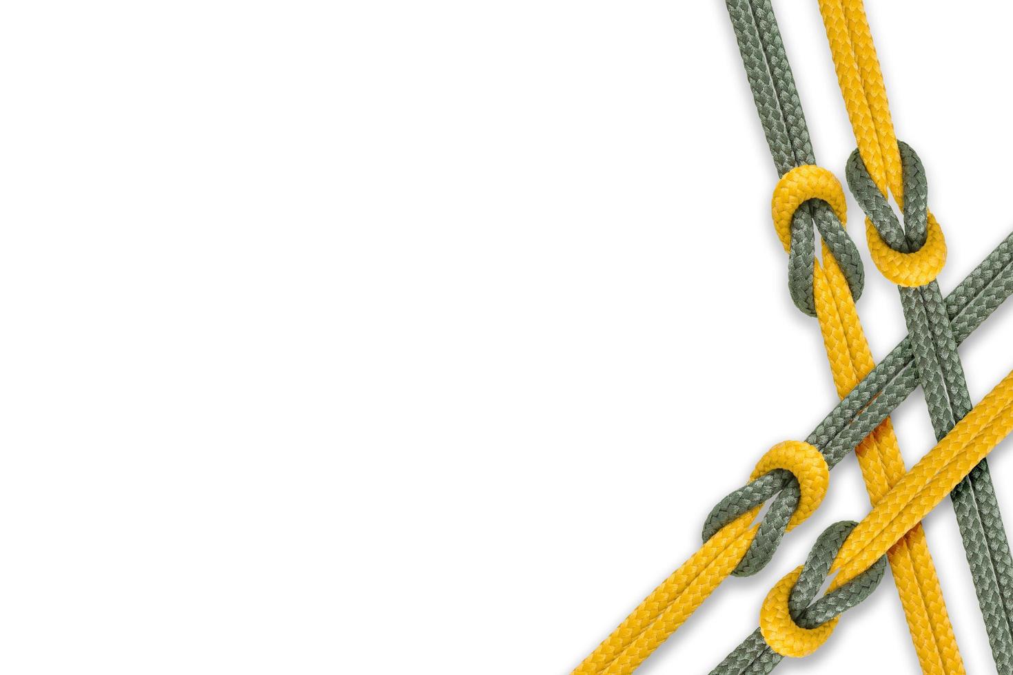 Different ropes tied together isolated on a white background photo