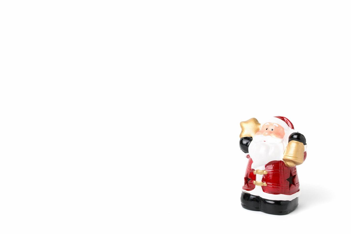 Figurine of Santa Claus on a white background photo