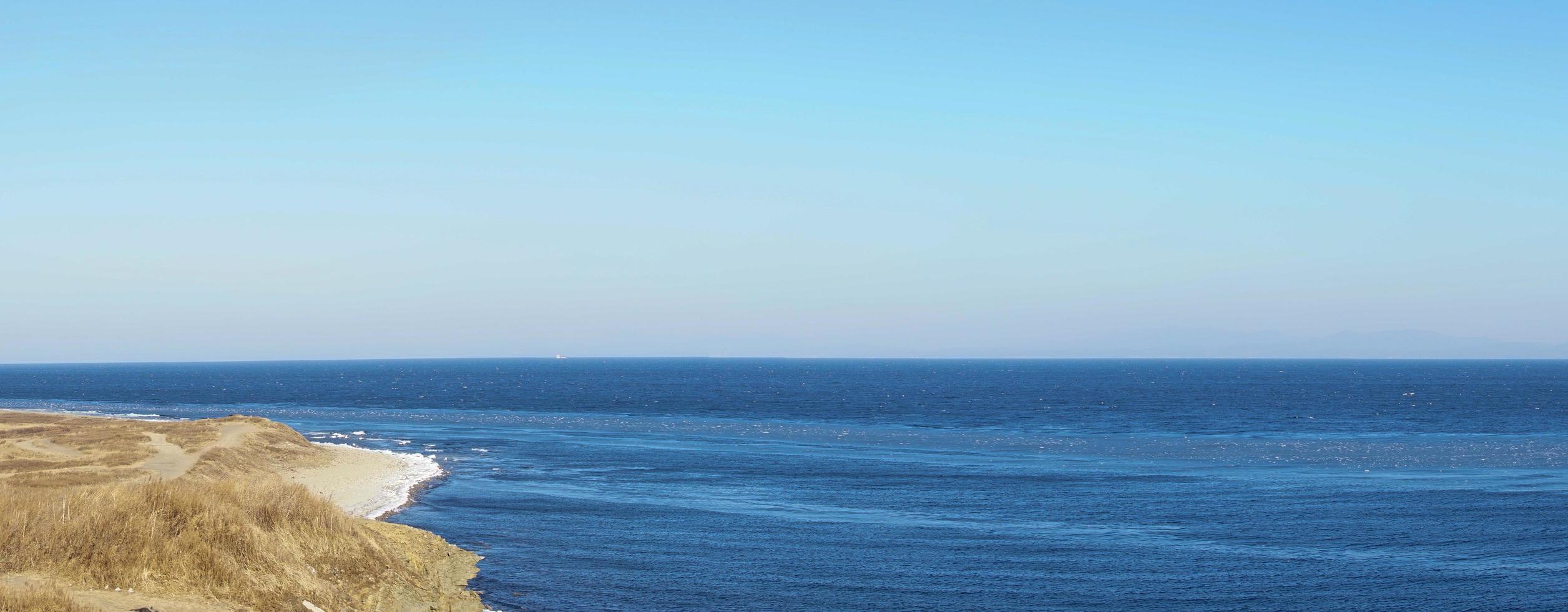 Panorama of a body of water with coastline in Vladivostok, Russia photo