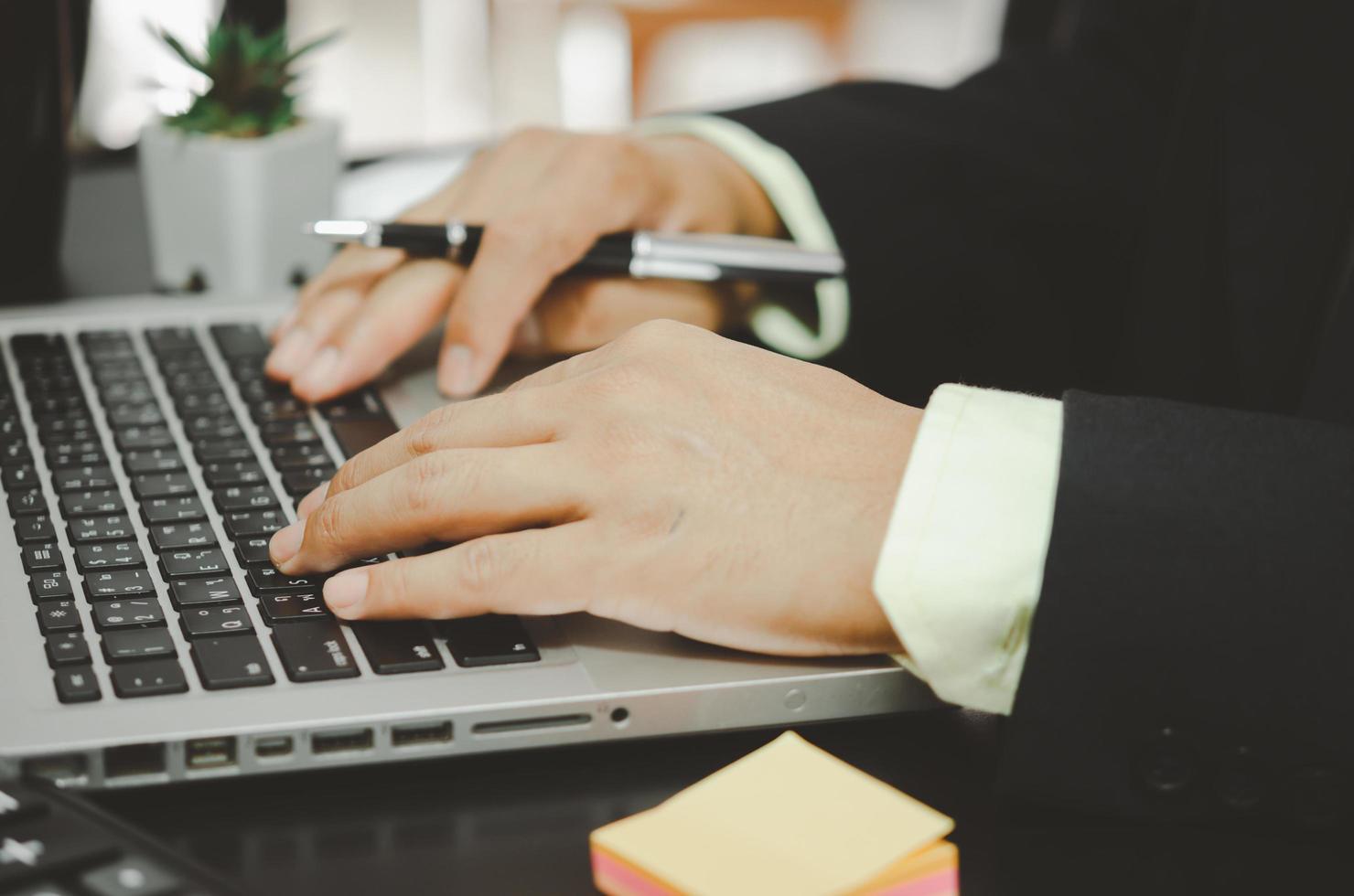 Business professional working on a laptop photo