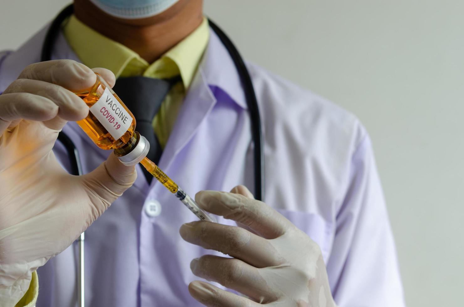 Medical professional getting COVID vaccine ready photo