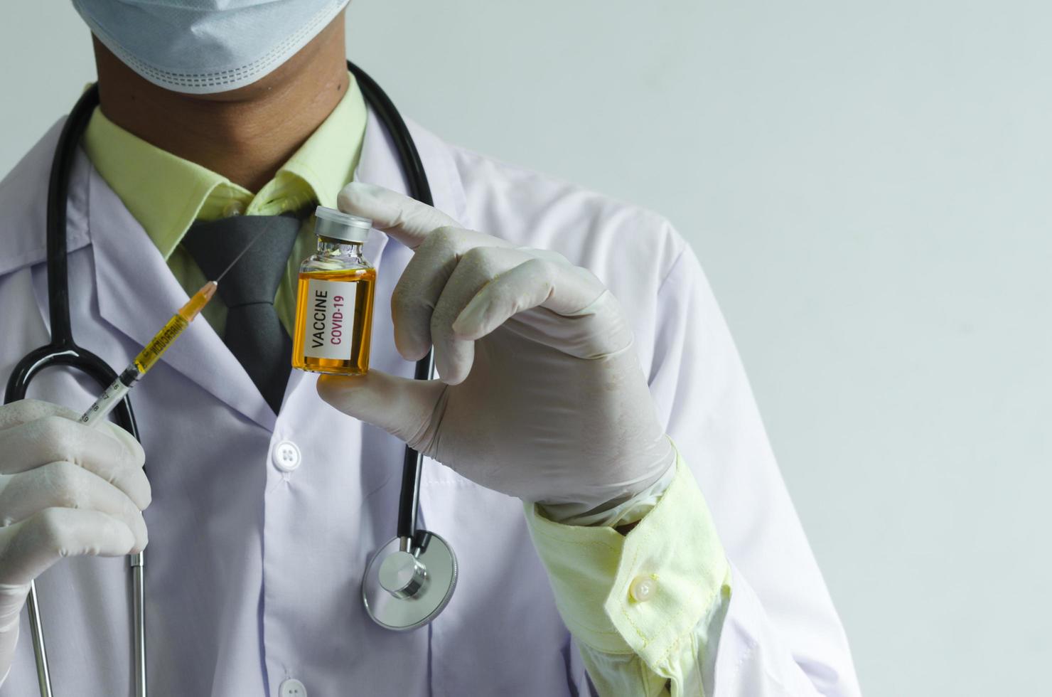 Medical professional holding a COVID vaccine photo