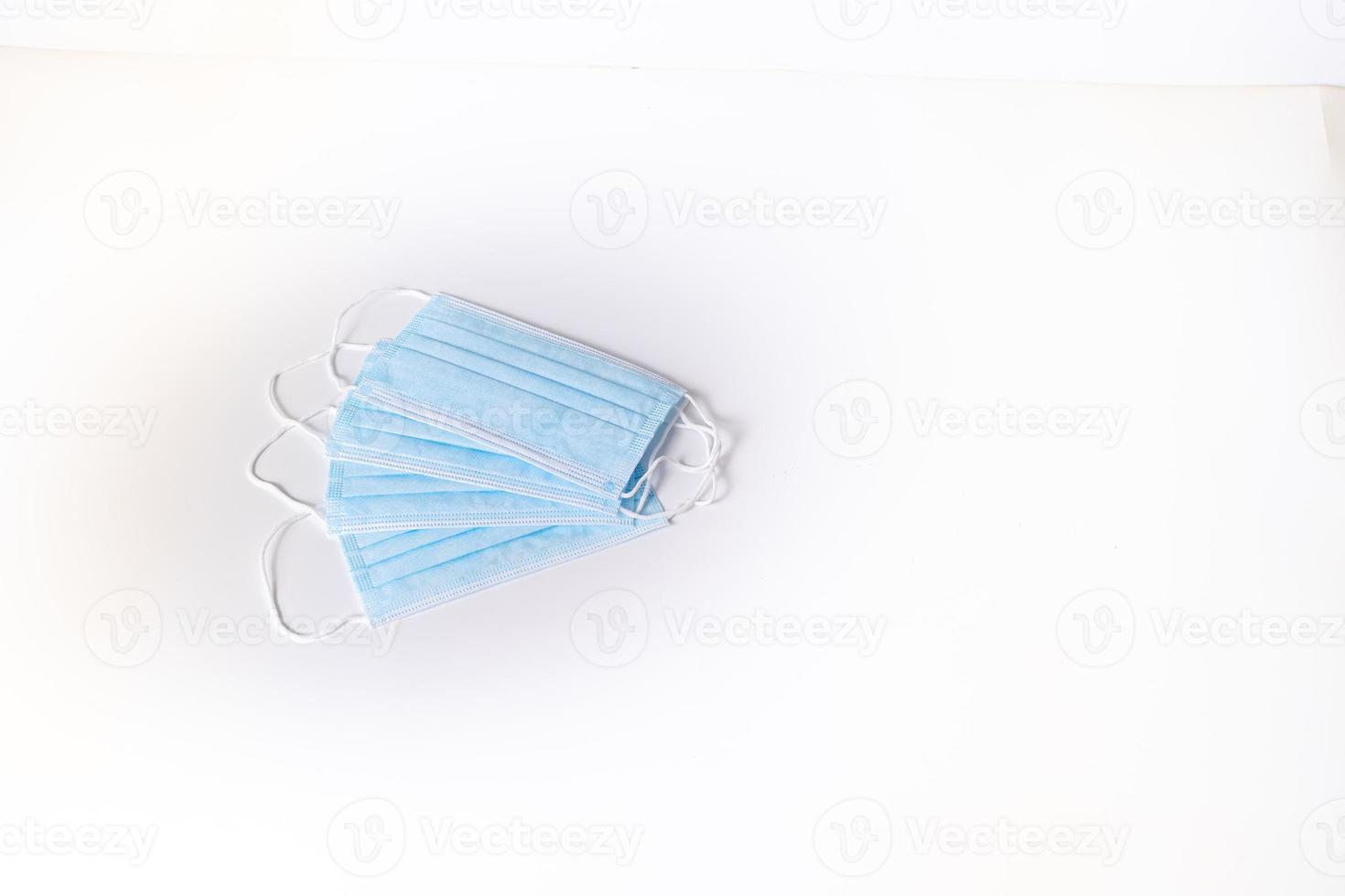 Surgical mask on white background photo