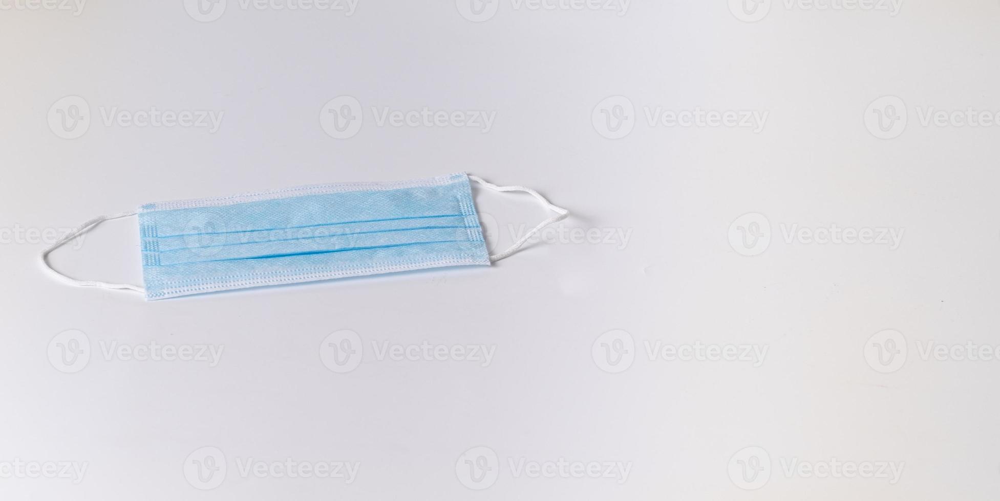 Surgical mask on white background photo