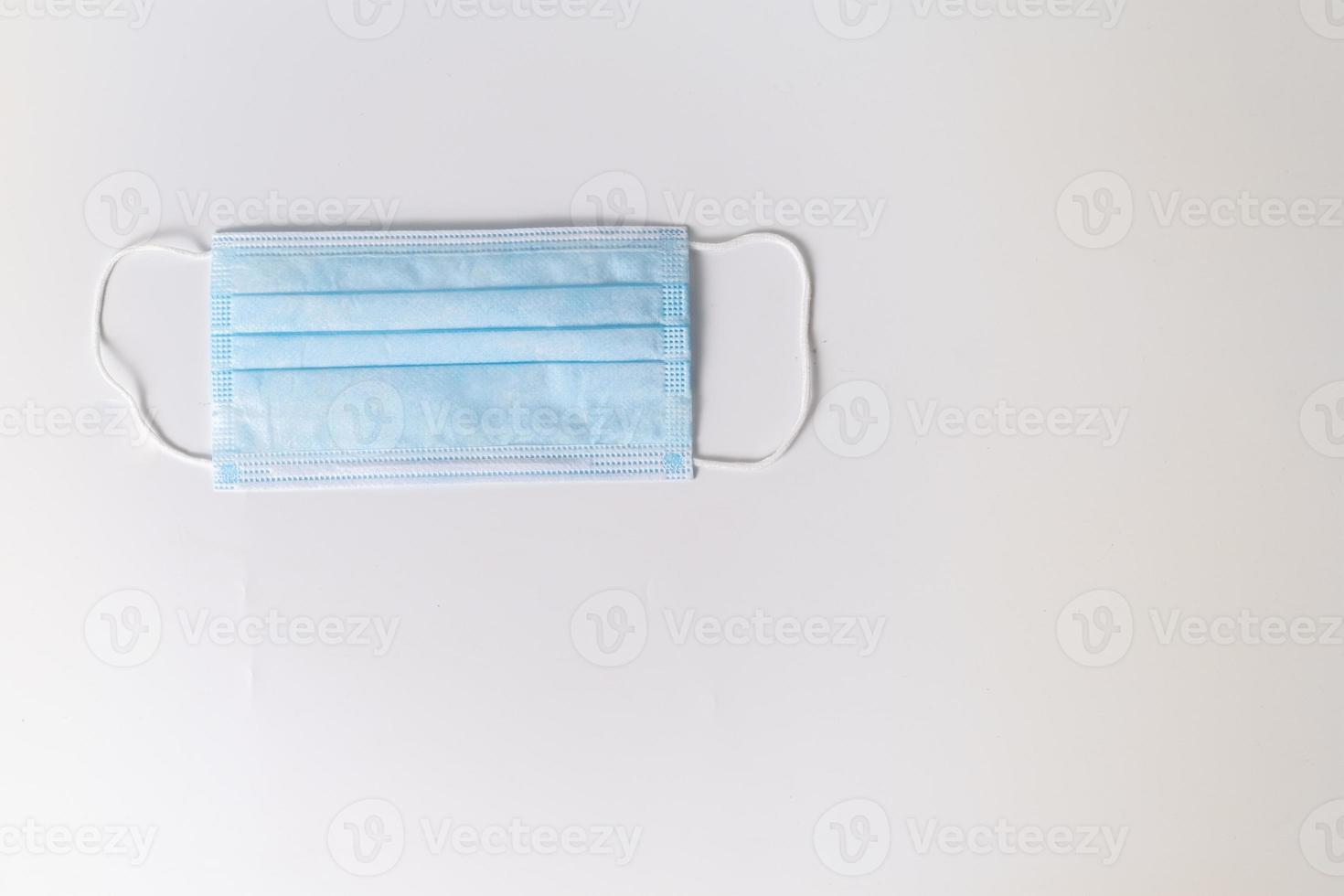 Surgical mask on white background photo