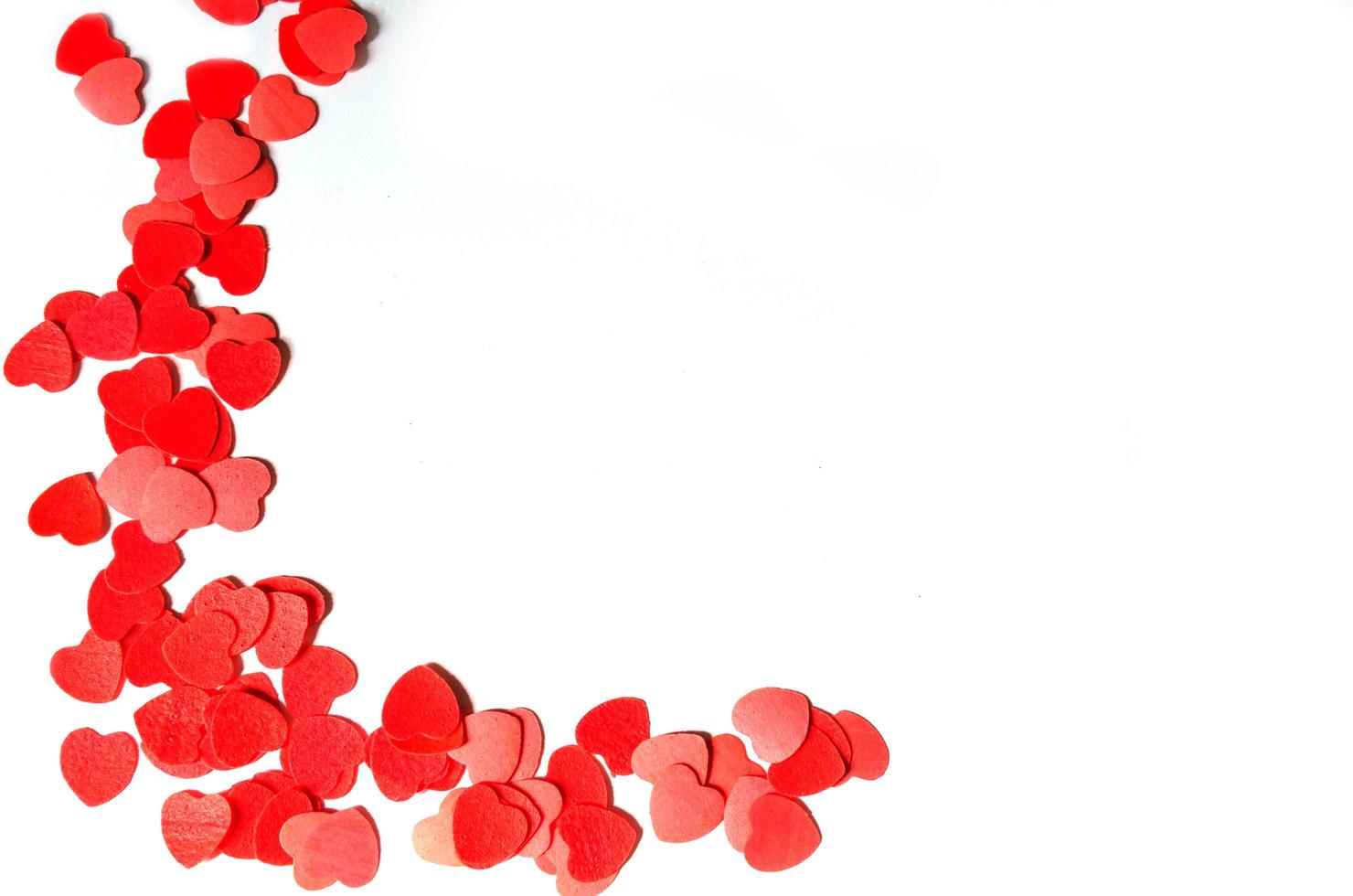 Red hearts on white photo