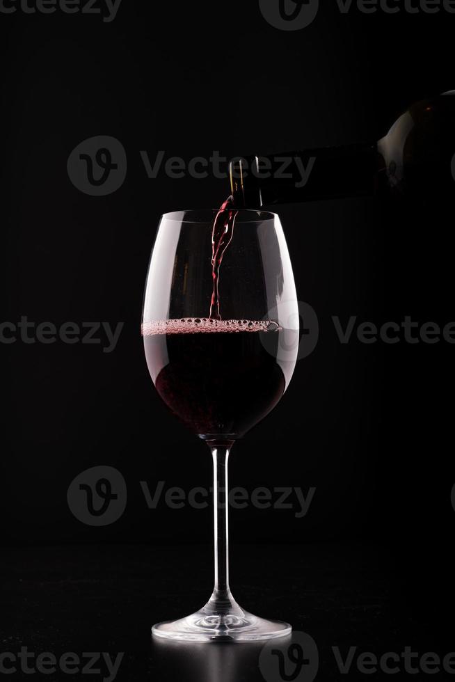 Closeup wine glass filling photo