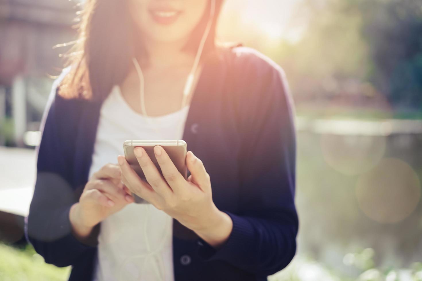 Woman using smartphone photo