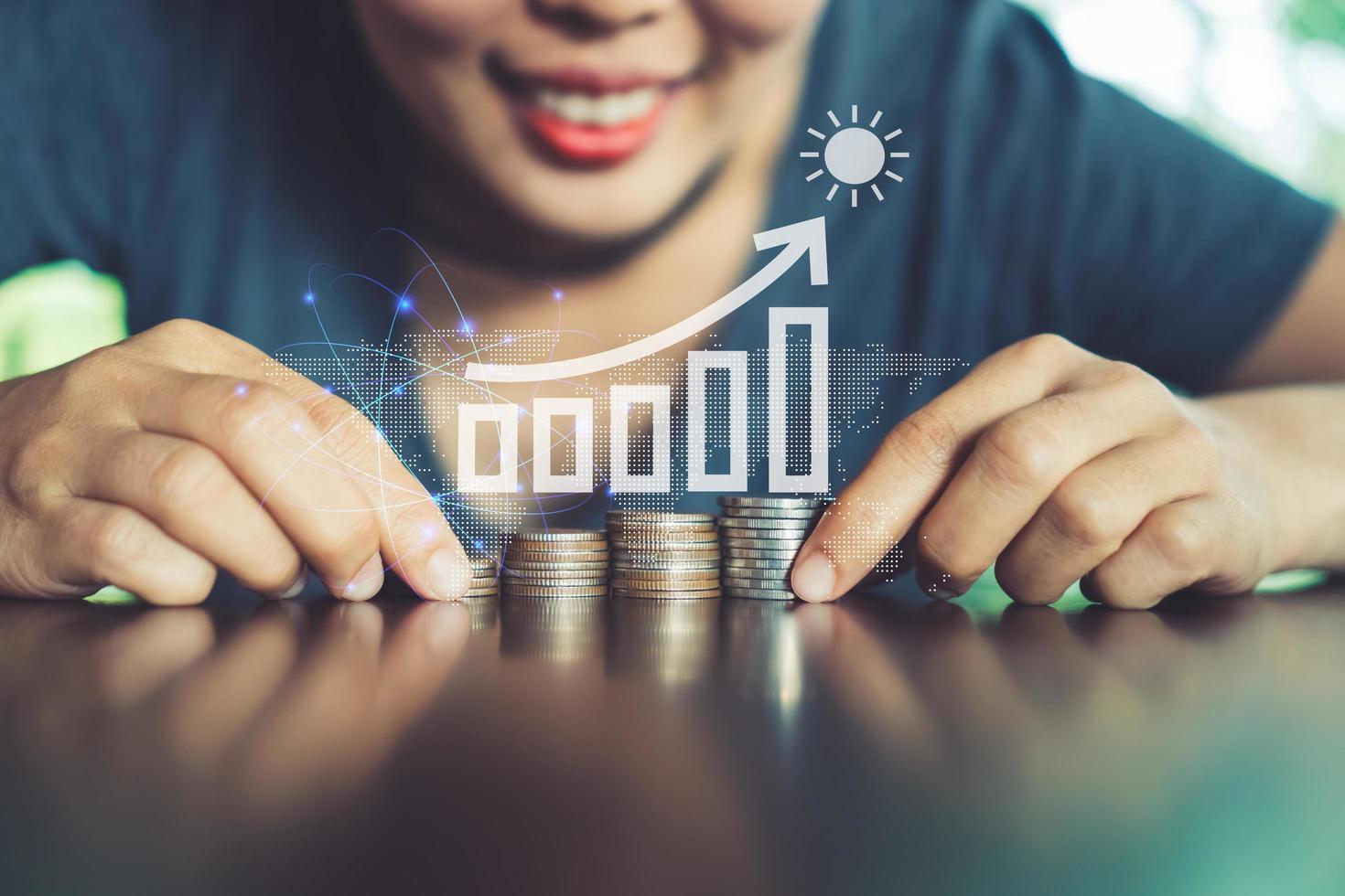 Gold coins on table and green nature bokeh background photo