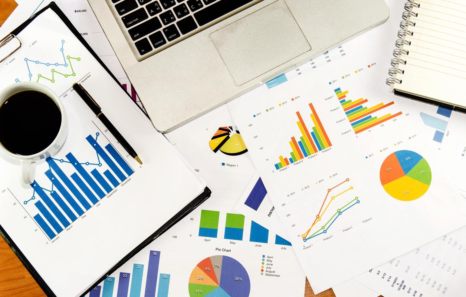 Top view of charts and graphs on a desk photo