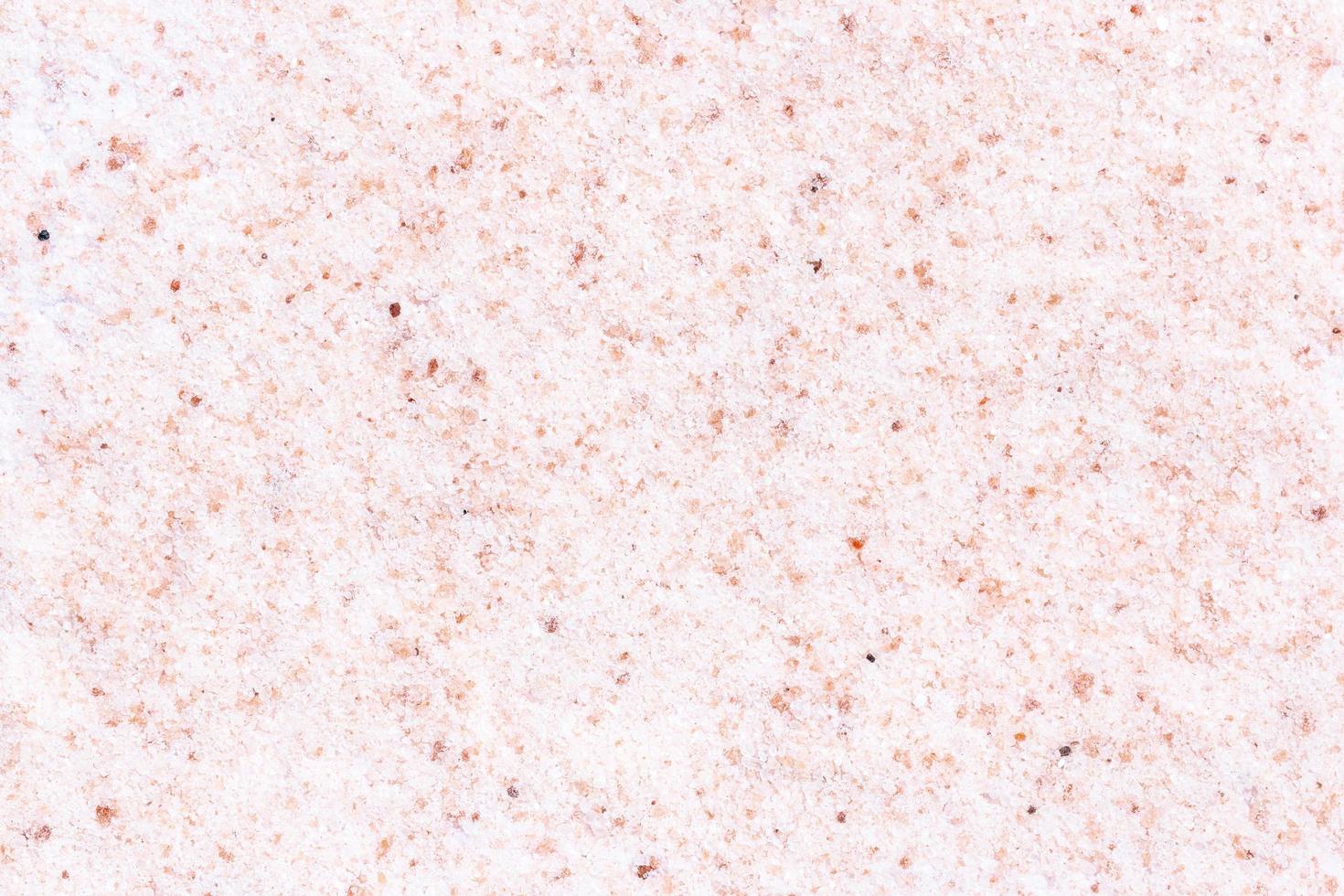 Pink salt Himalayan salt on a white background photo