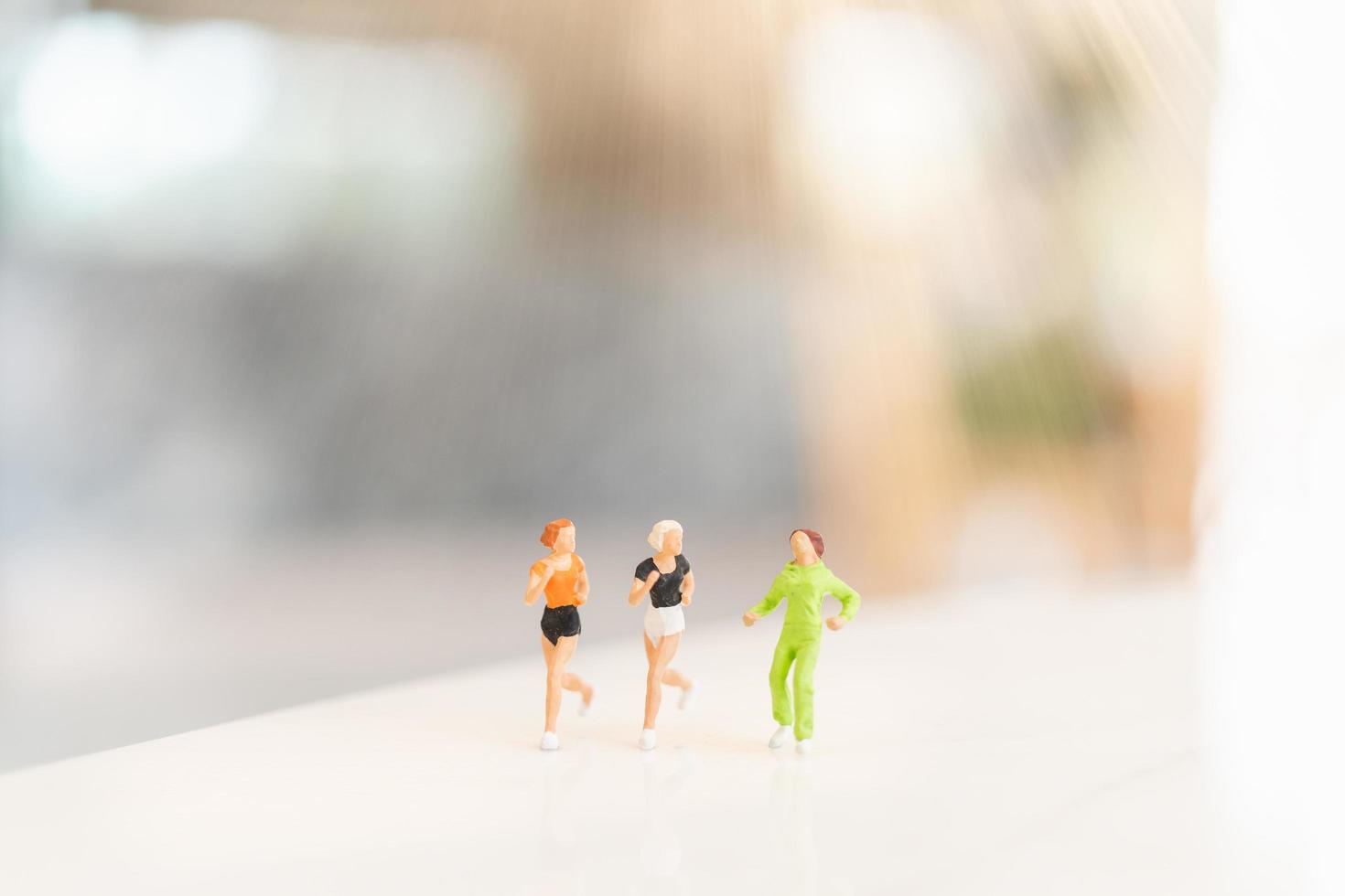 Miniature people running, health and sports concept photo