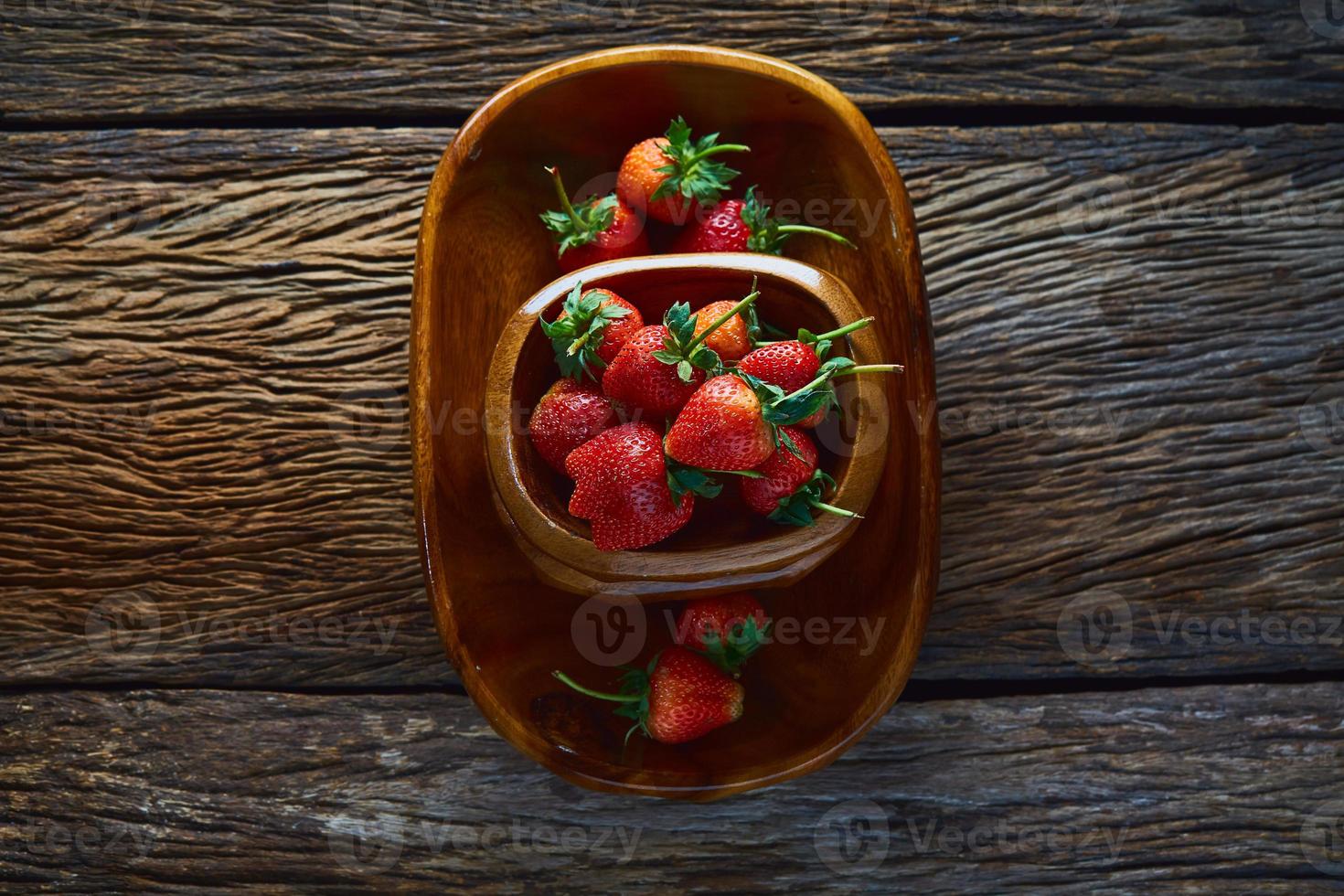 Strawberries on a wooden background photo