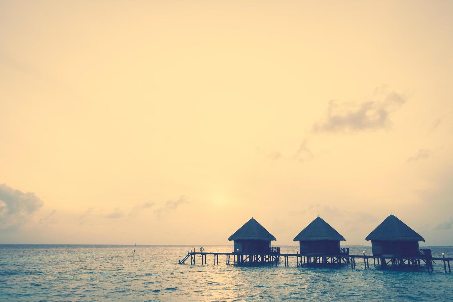 Sunset over a resort on the Maldives photo