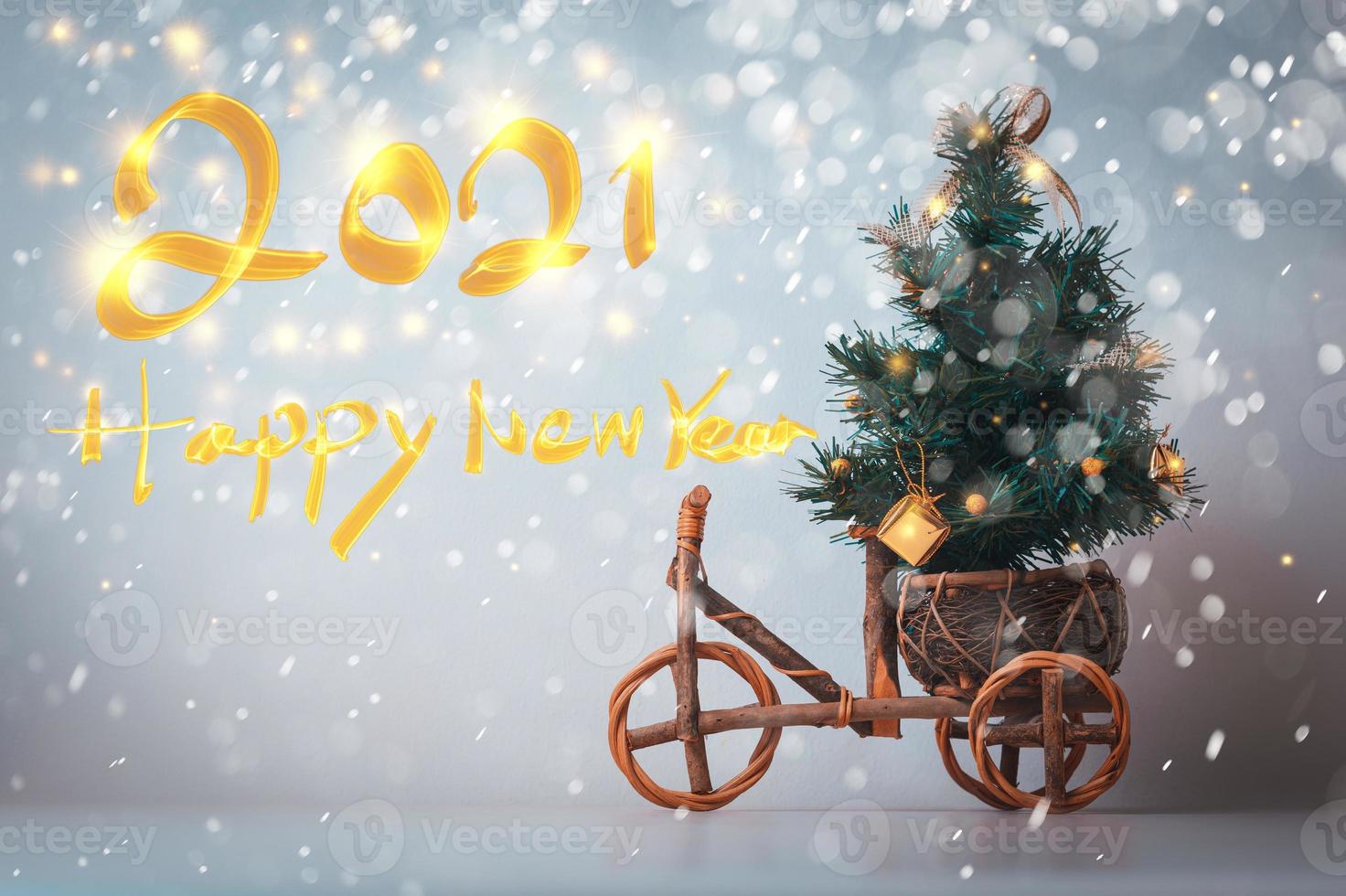 Christmas tree on a wood car with a 2021 Happy New Year text photo