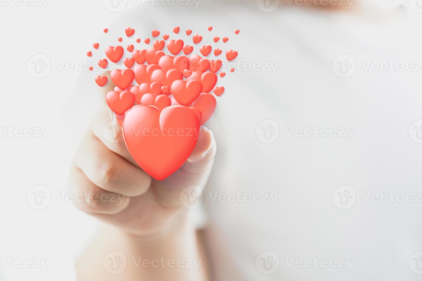 A hand holding hearts photo