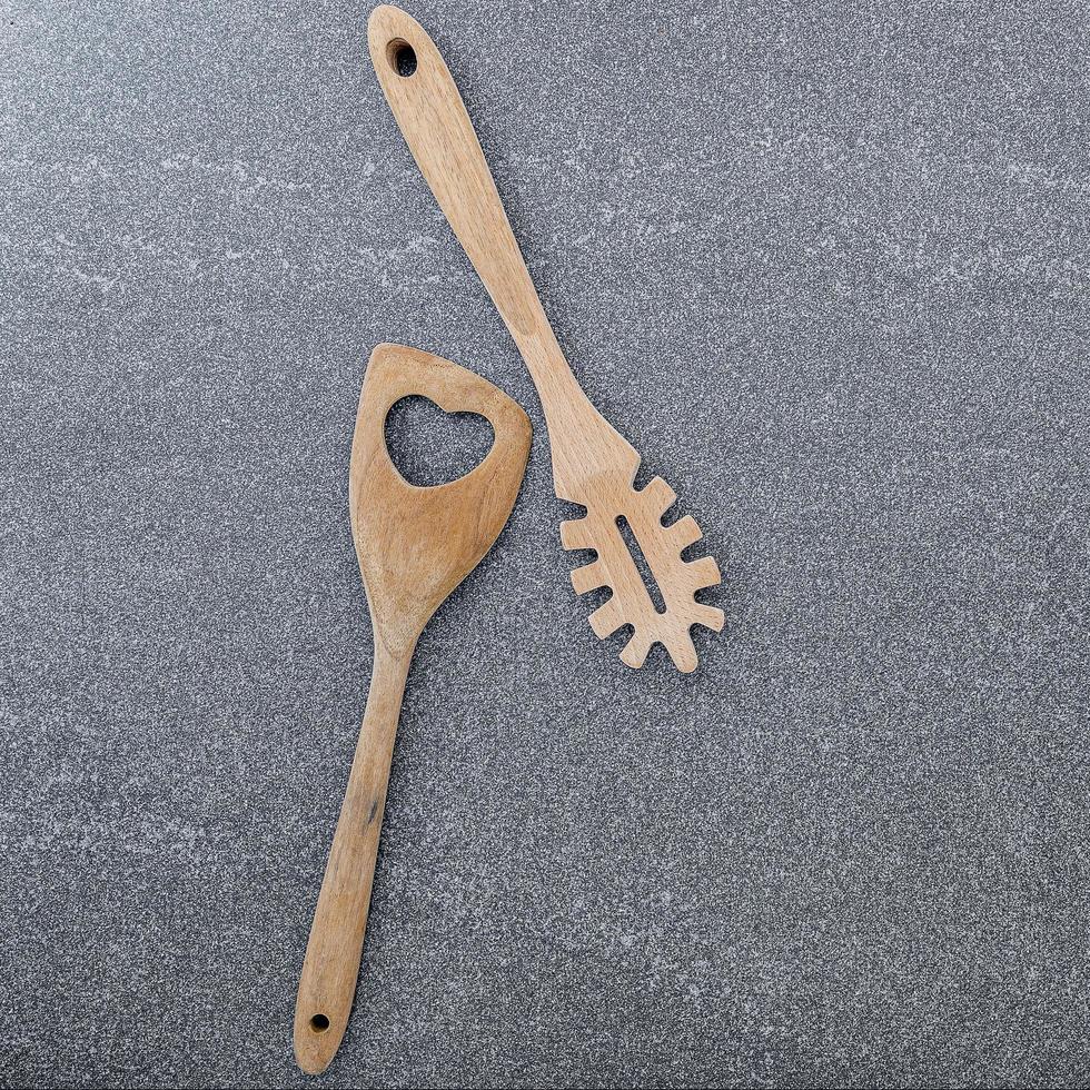 Wood utensils on a concrete background photo