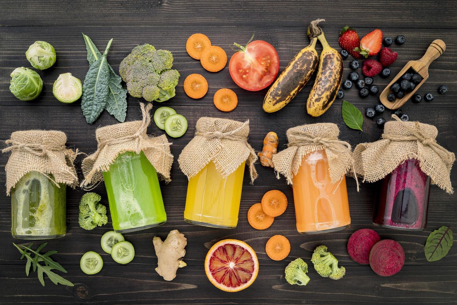 Jars of fresh veggie and fruit juices photo