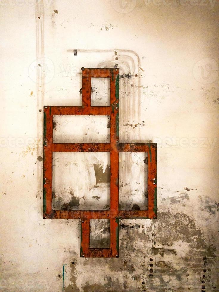 Red iron rectangles in an old abandoned building photo