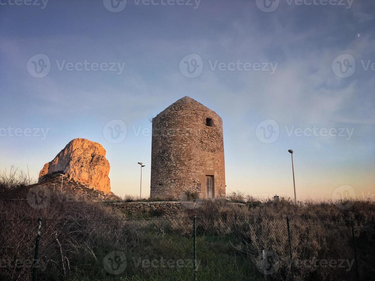 Old abandoned windmill in Calpe photo