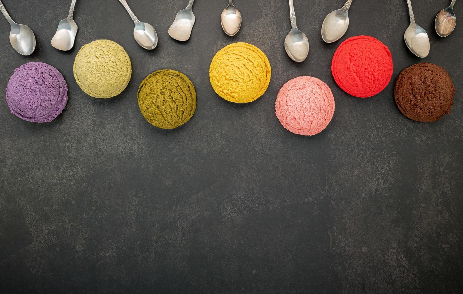 Colorful ice cream and spoons with copy space photo