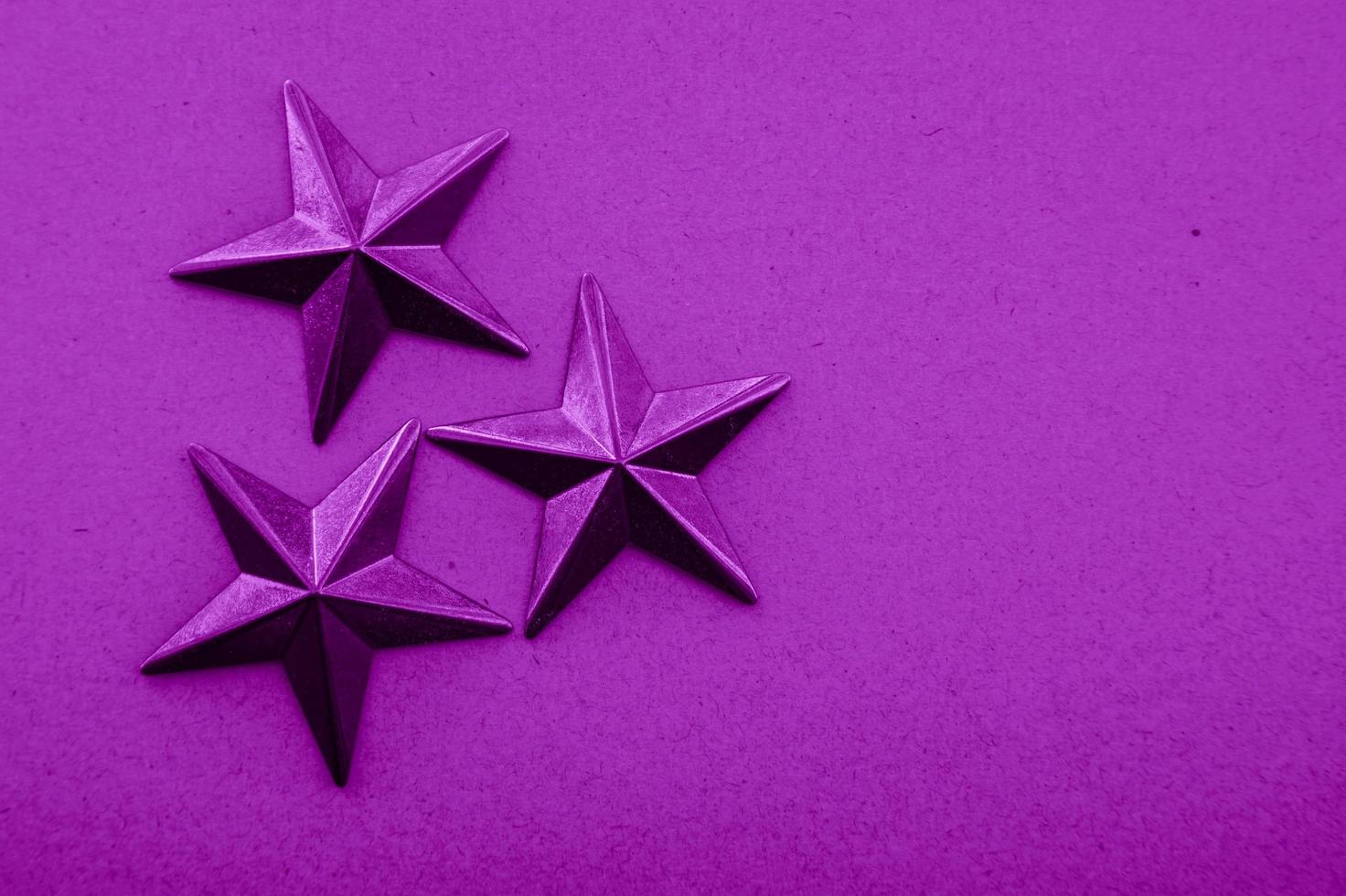 Purple star decoration textured background photo