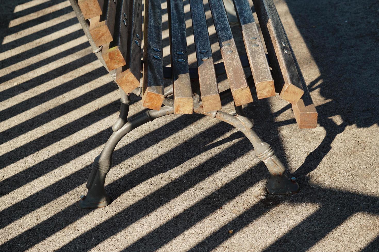 Wooden bench on the street photo