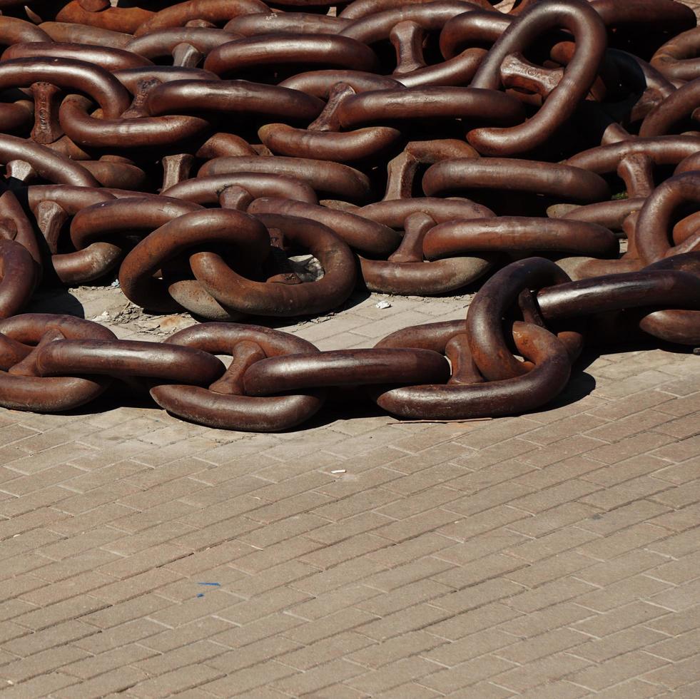 Old brown chain in the seaport photo