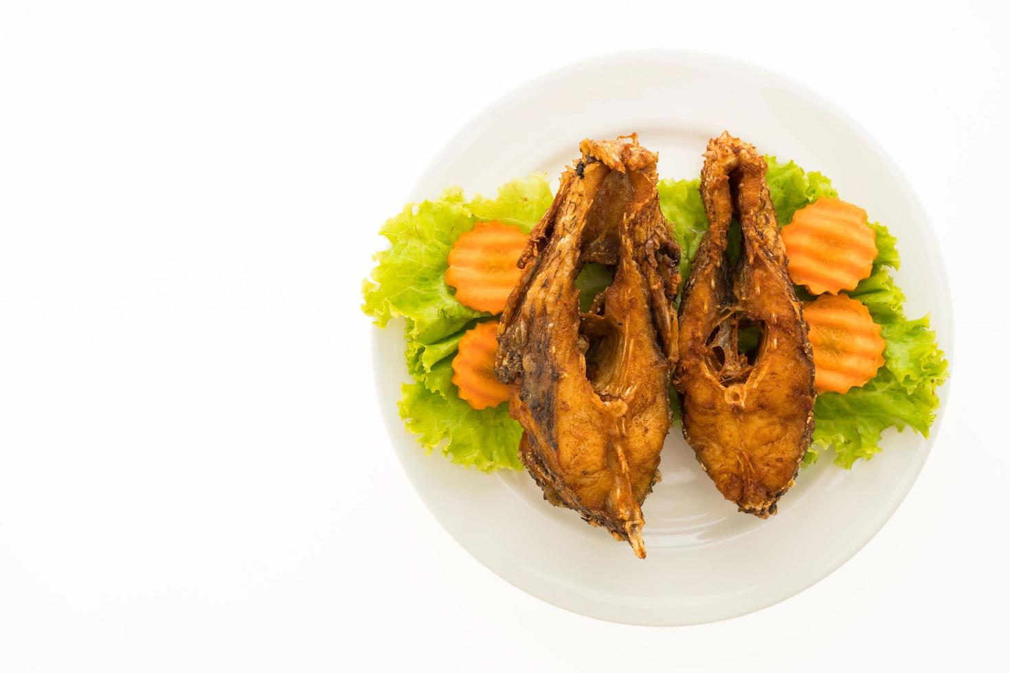Fried fish on white plate photo