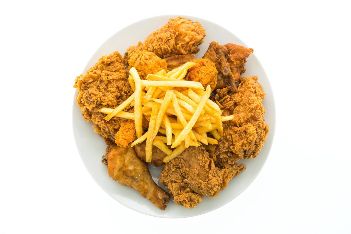 Fried chicken and french fries on a white plate photo