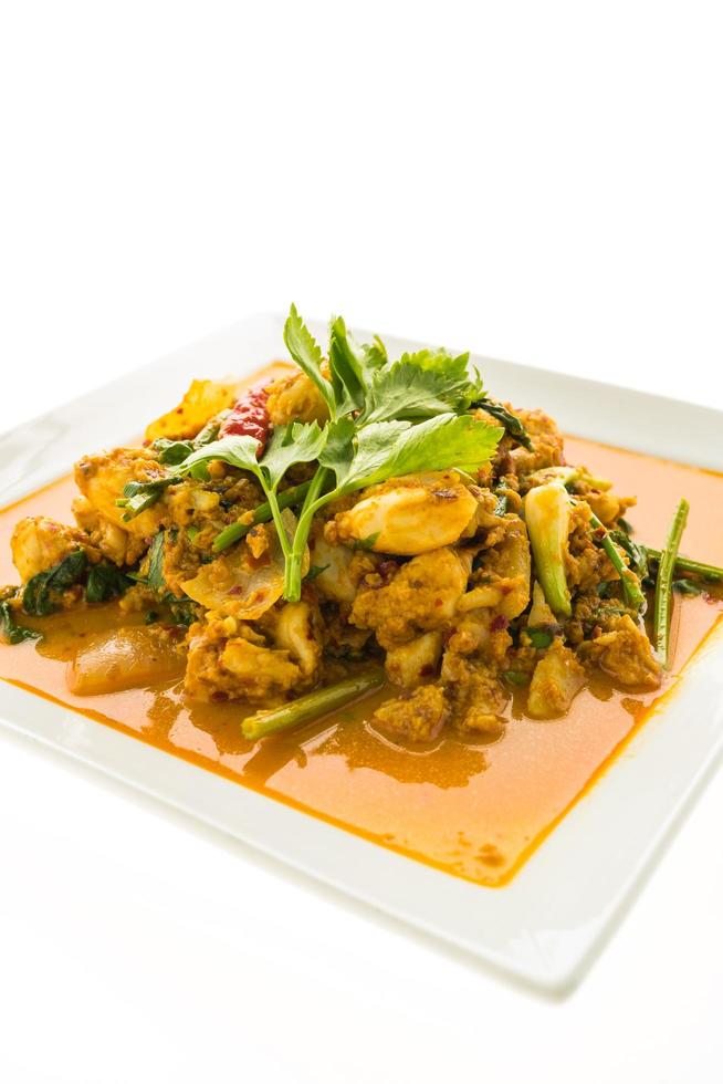 Stir fried crab with curry on white plate photo