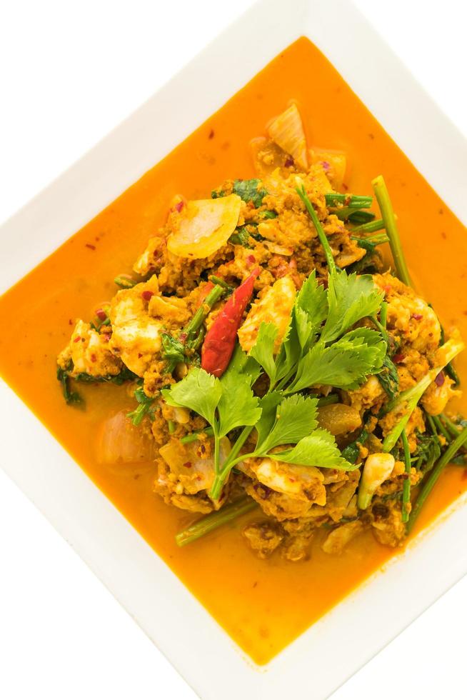 Stir fried crab with curry on white plate photo