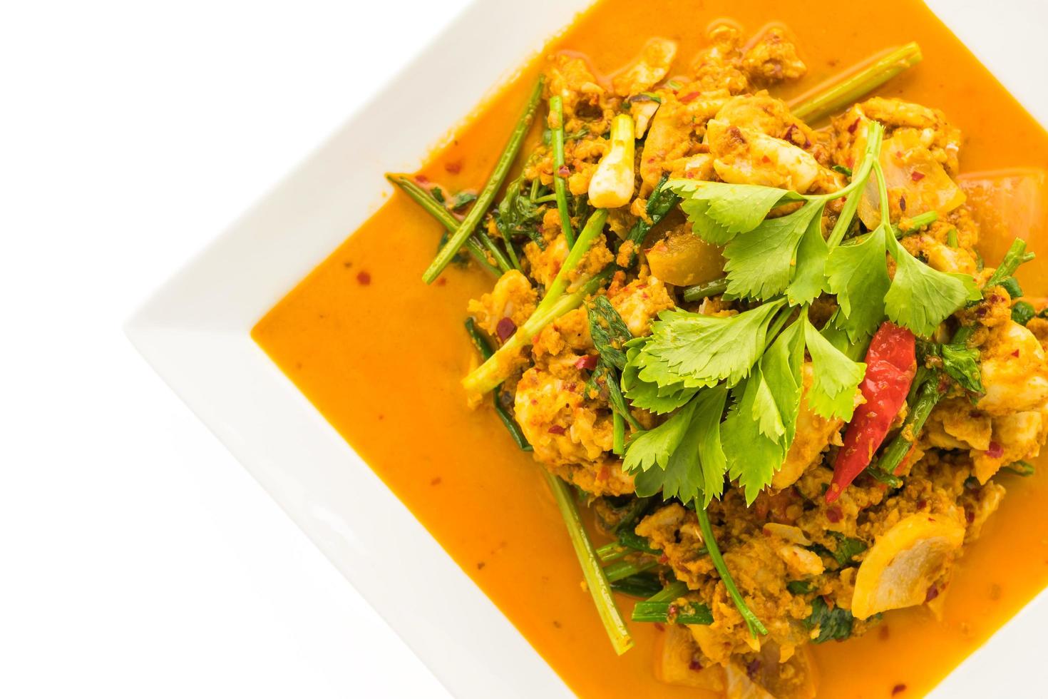 Stir fried crab with curry on white plate photo