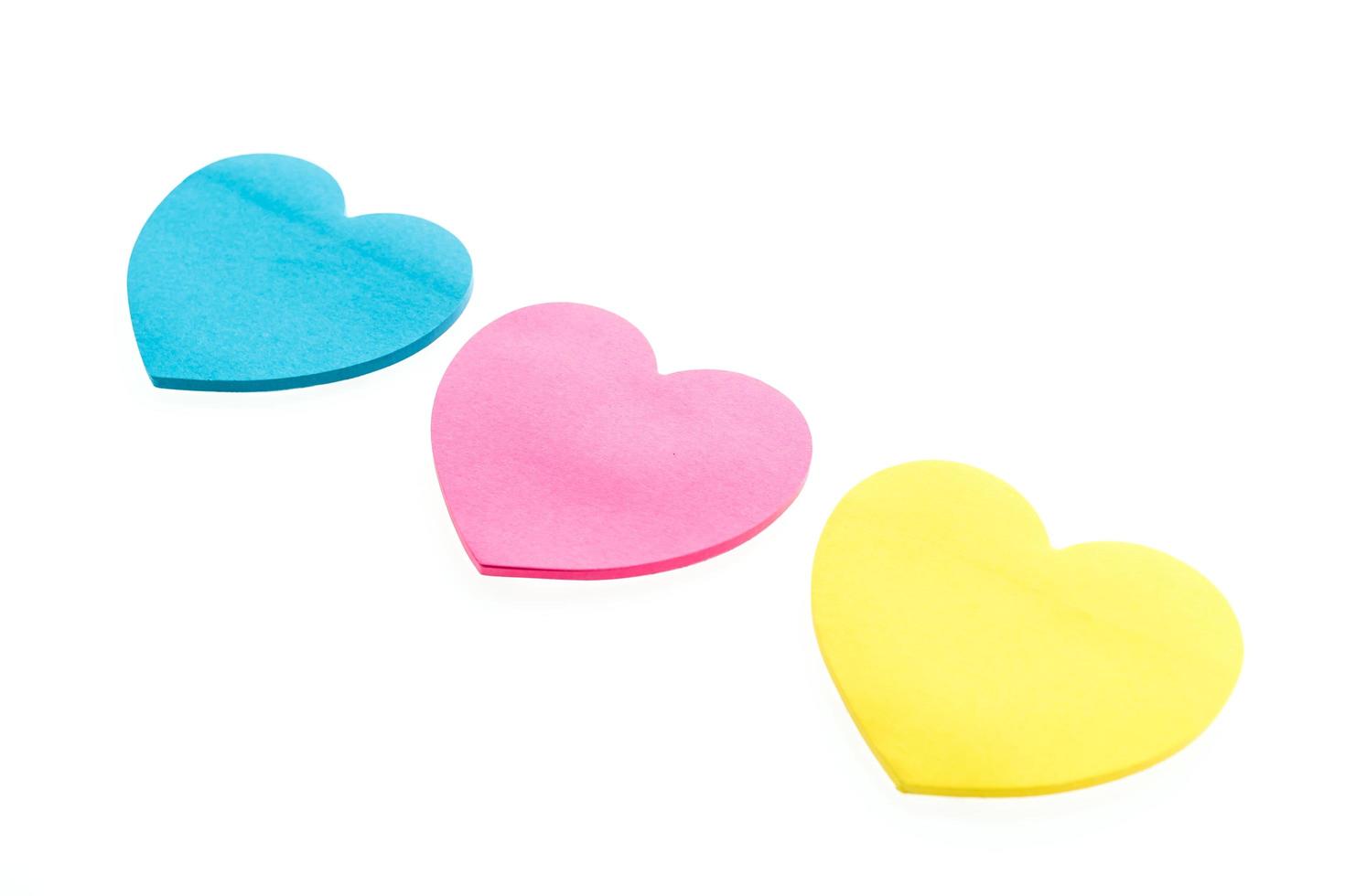 Paper hearts on white background photo