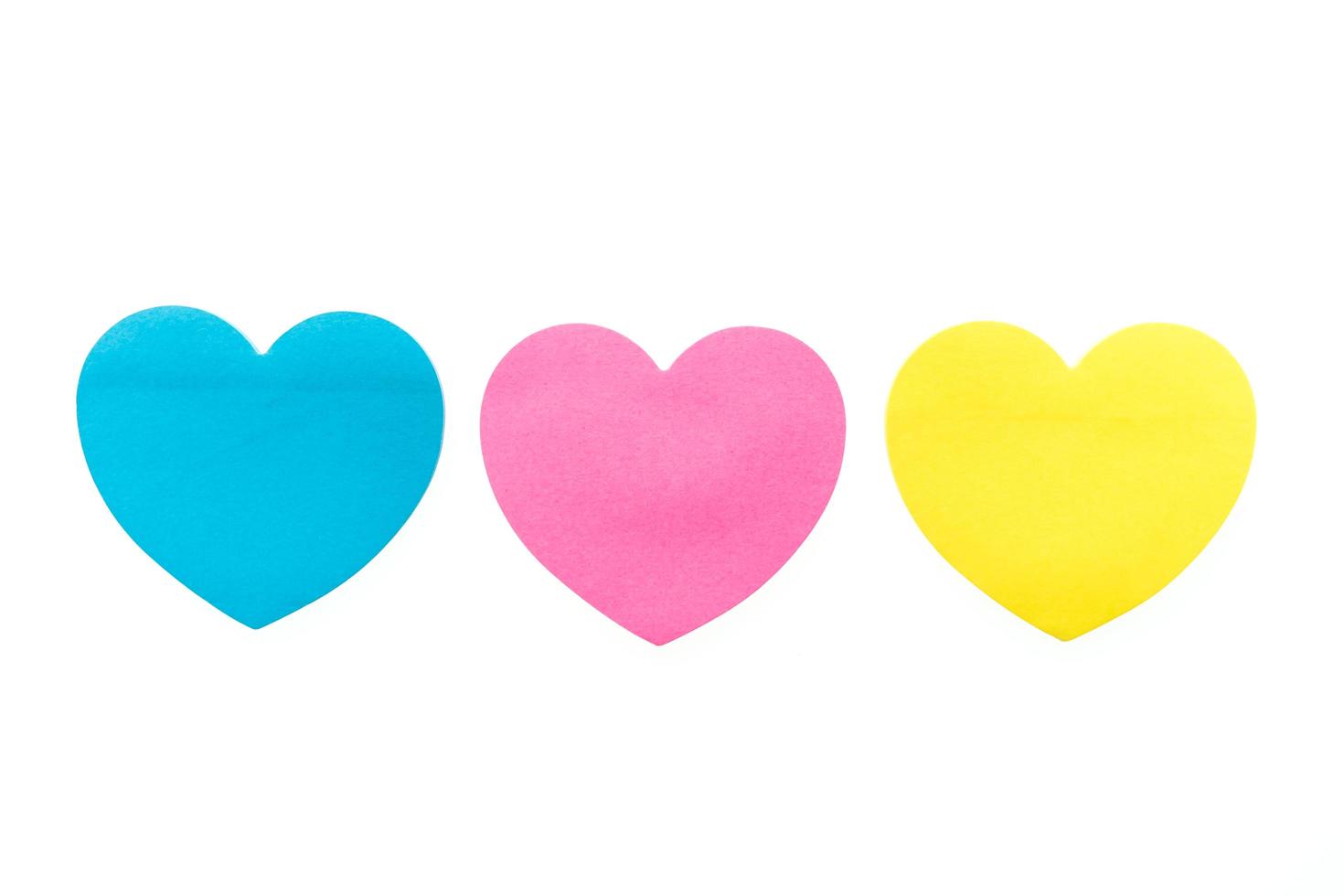 Paper hearts on white background photo
