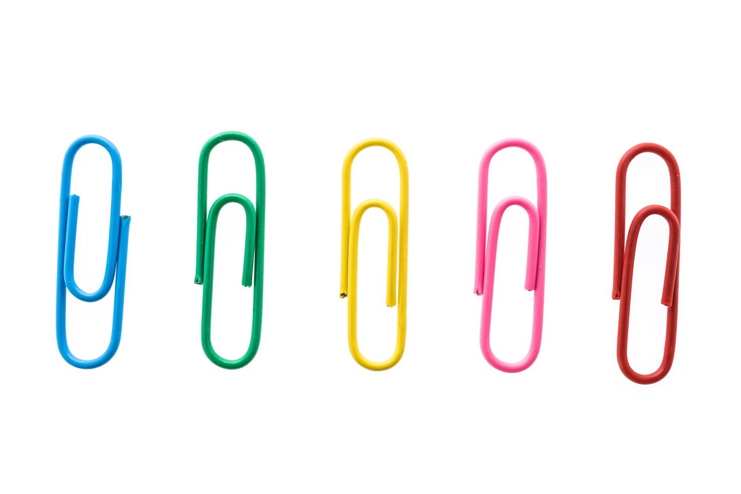 Paper clips on white background photo