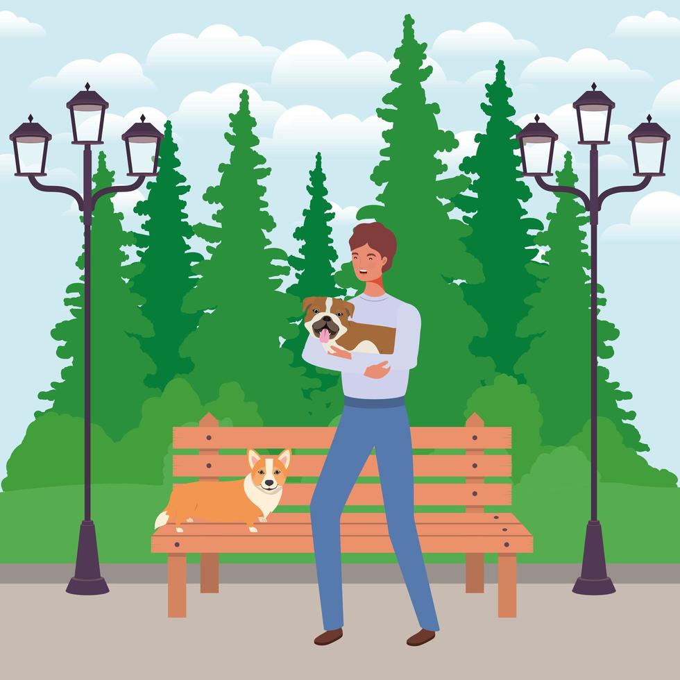 young man with cute dogs mascots in the park vector
