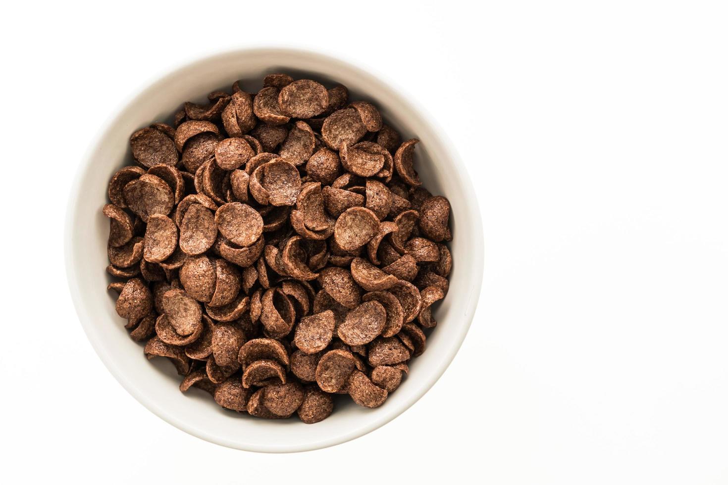 Chocolate cereals in white bowl photo