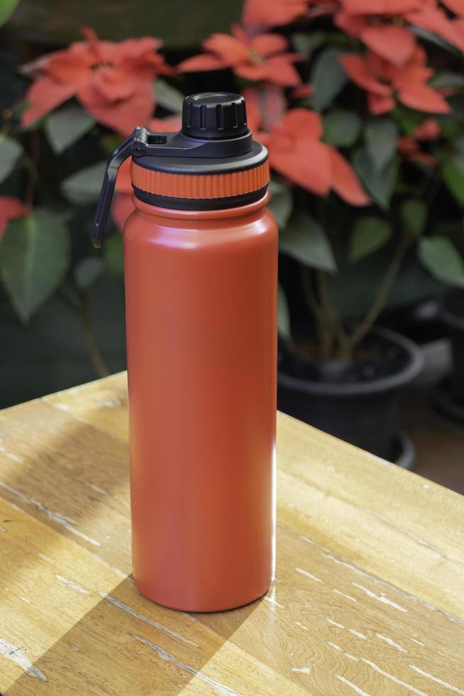 Red travel thermos photo