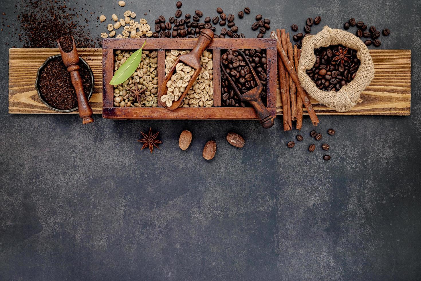 Wooden board with roasted coffee beans on it photo